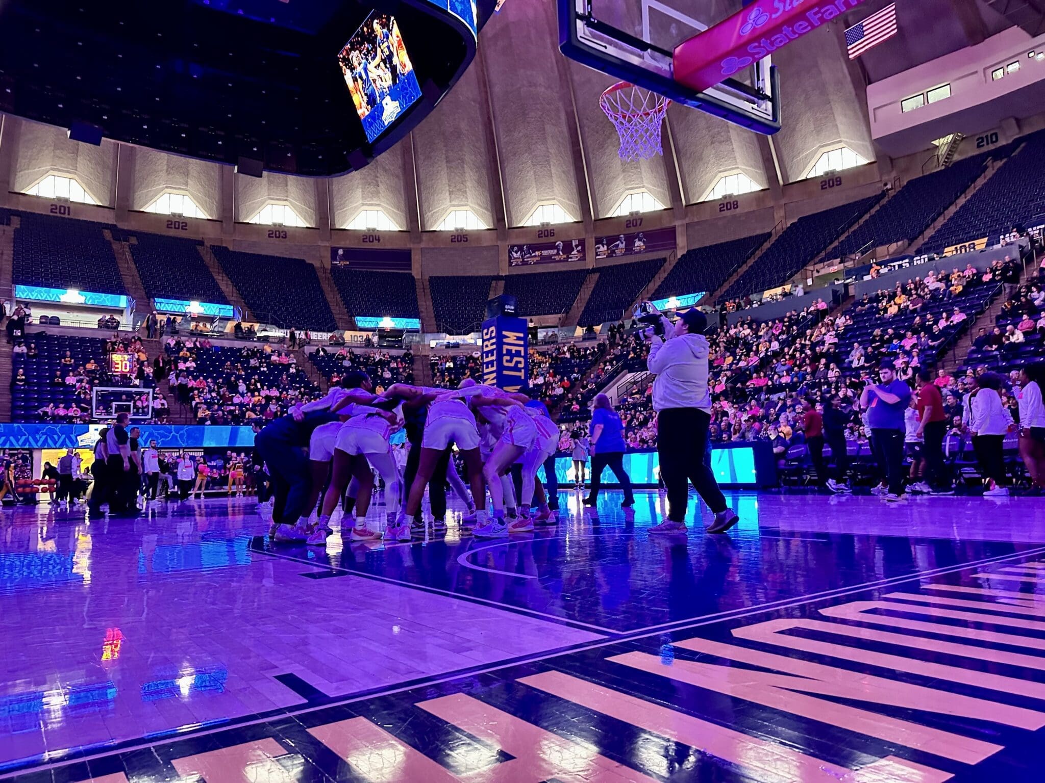 WVU Women's Basketball team huddle