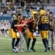 WVU Football HC Neal Brown with Nicco Marchiol, Ryder Burton and Ja'Quay Hubbard celebrate touchdown on sidelines