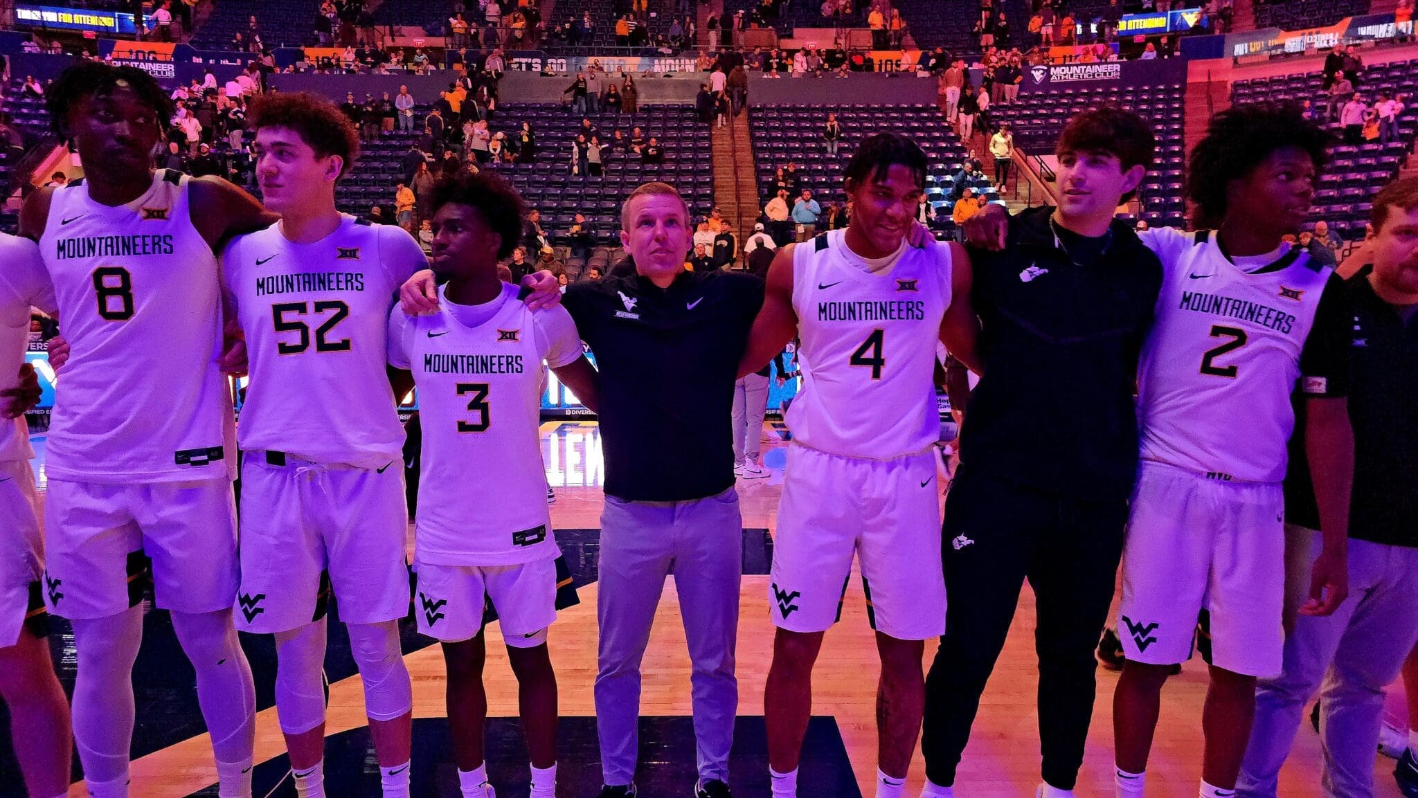 WVU Basketball Ross Hodge with players Country Roads