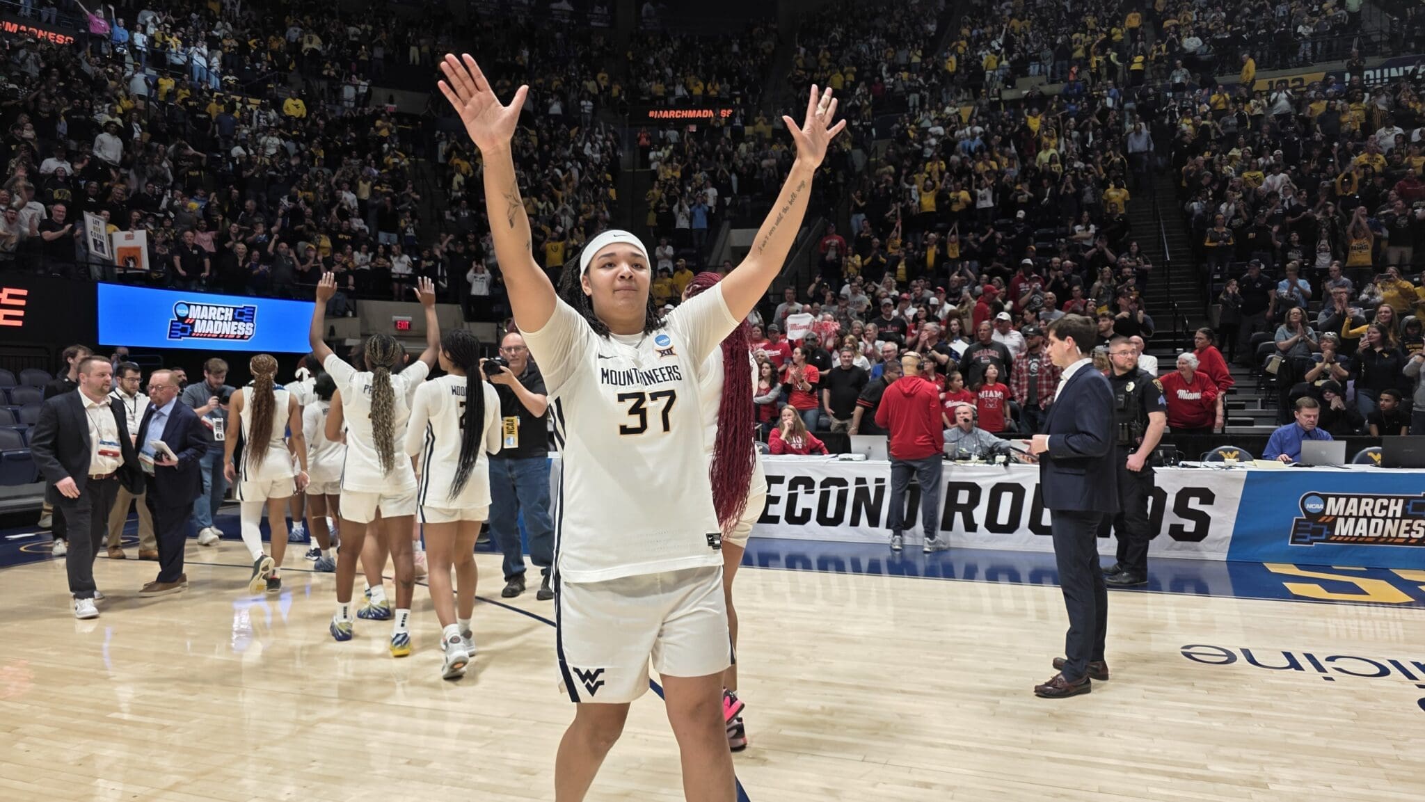 WVU Women's Basketball Celia Riviere thanks the Hope Coliseum crowd