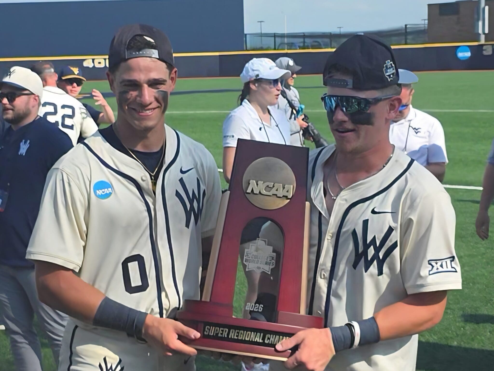 WVU baseball players with Super Regional trophy