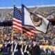 WVU Football Milan Puskar Stadium- American/WV Flag stock