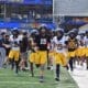 WVU Football running on field for spring scrimmage