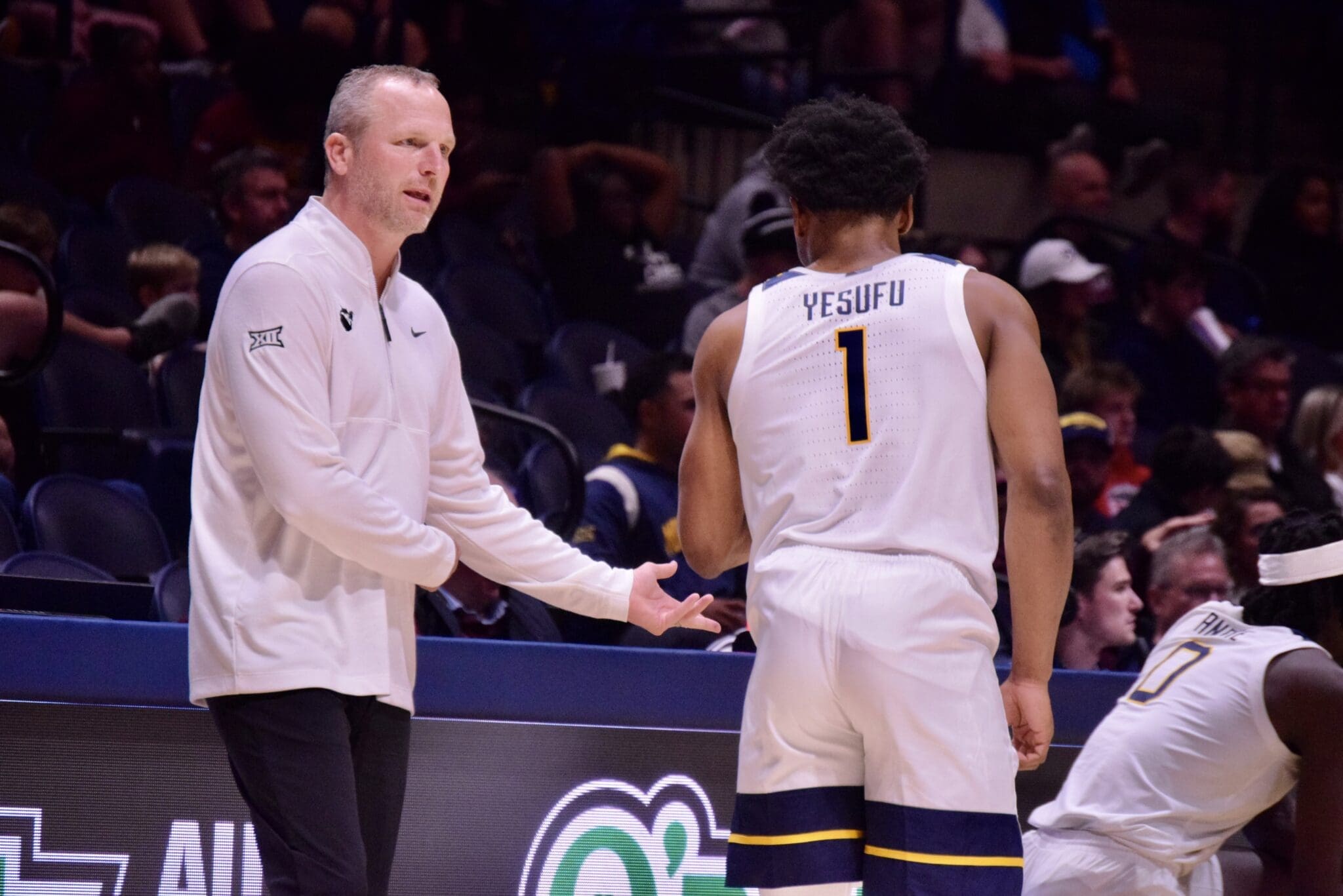 WVU Basketball Head Coach Darian DeVries and Joseph Yesufu