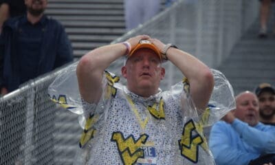 WVU Football fan hands on head during Utah game