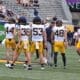 WVU Football HC Rich Rodriguez with players during Spring Showcase