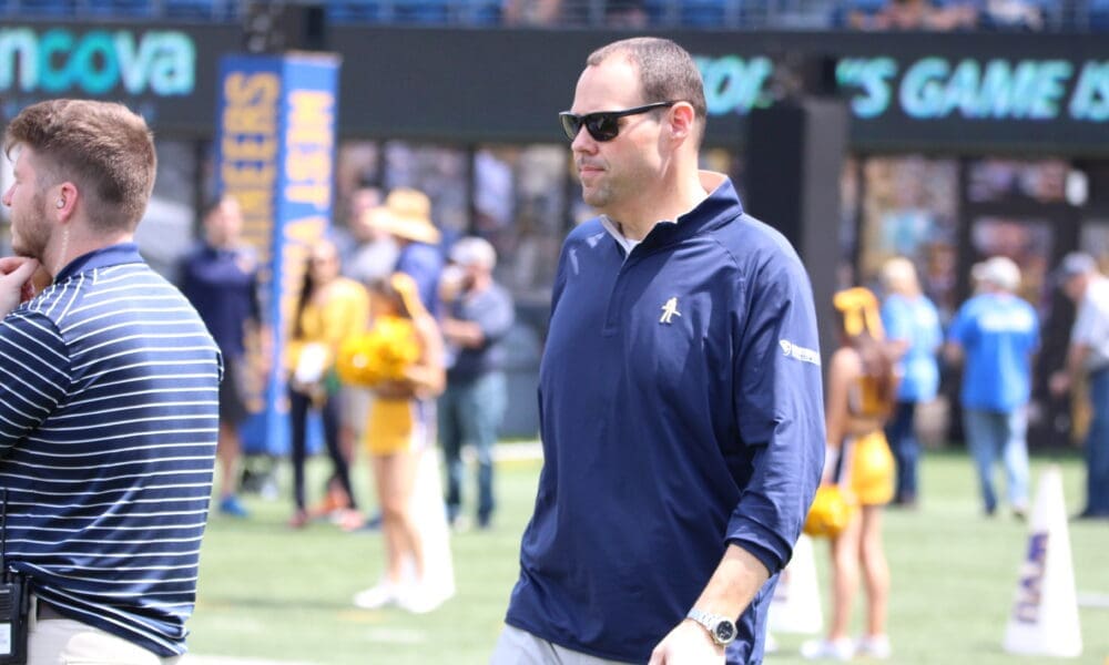 WVU AD Wren Baker on field