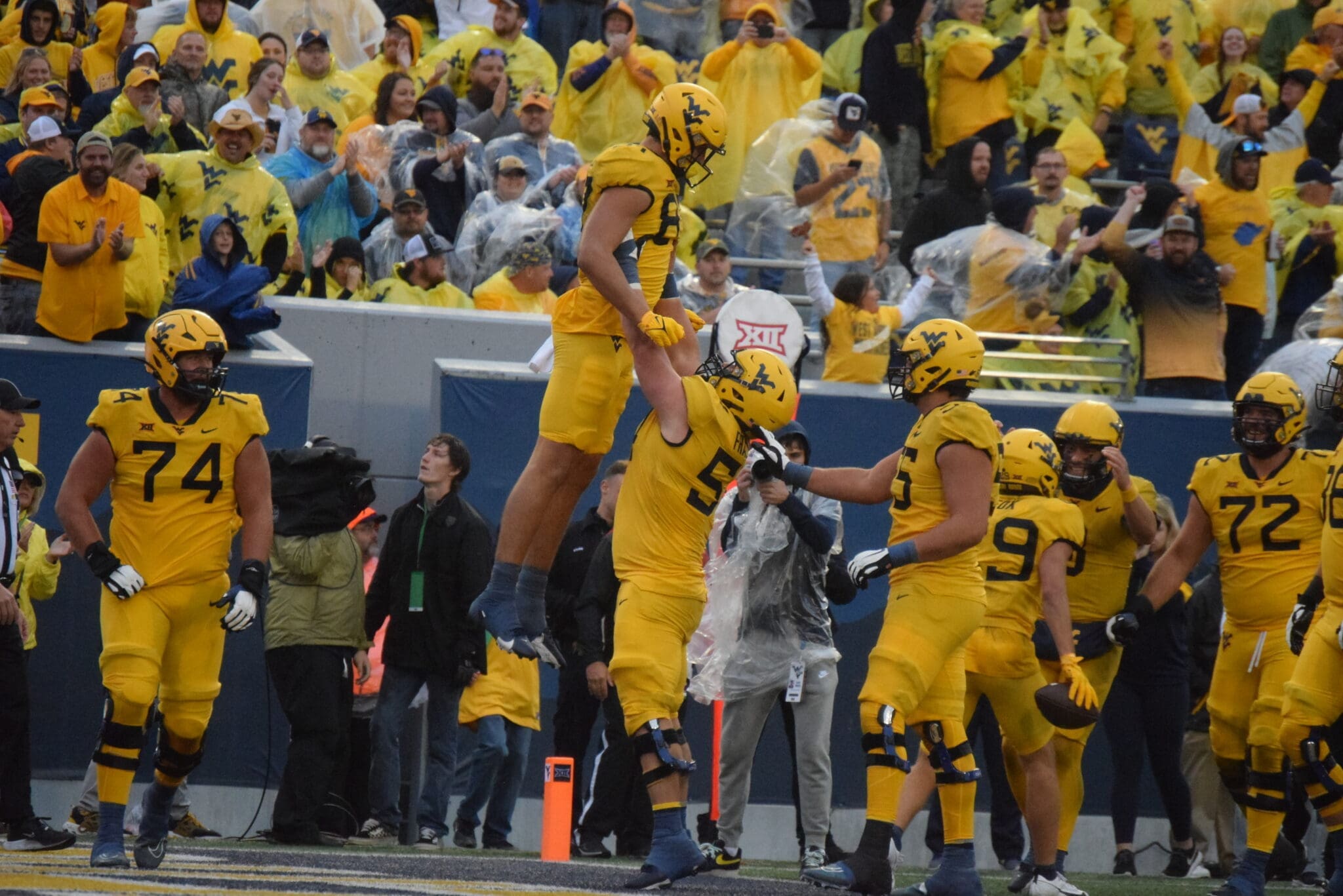WVU Football TE Kole Taylor celebrates a TD against Texas Tech with Zach Frazier, Wyatt Milum and Doug Nester in image
