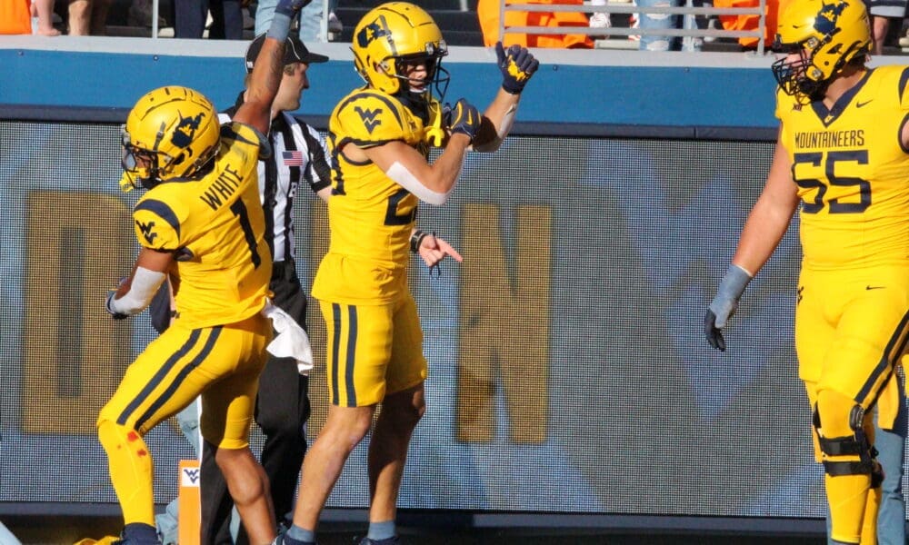 WVU Football Jahiem White and Preston Fox celebrate