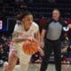 WVU Women's Basketball guard JJ Quinerly dribbles the ball during the Mountaineers' February 17 game against No. 23 Oklahoma.