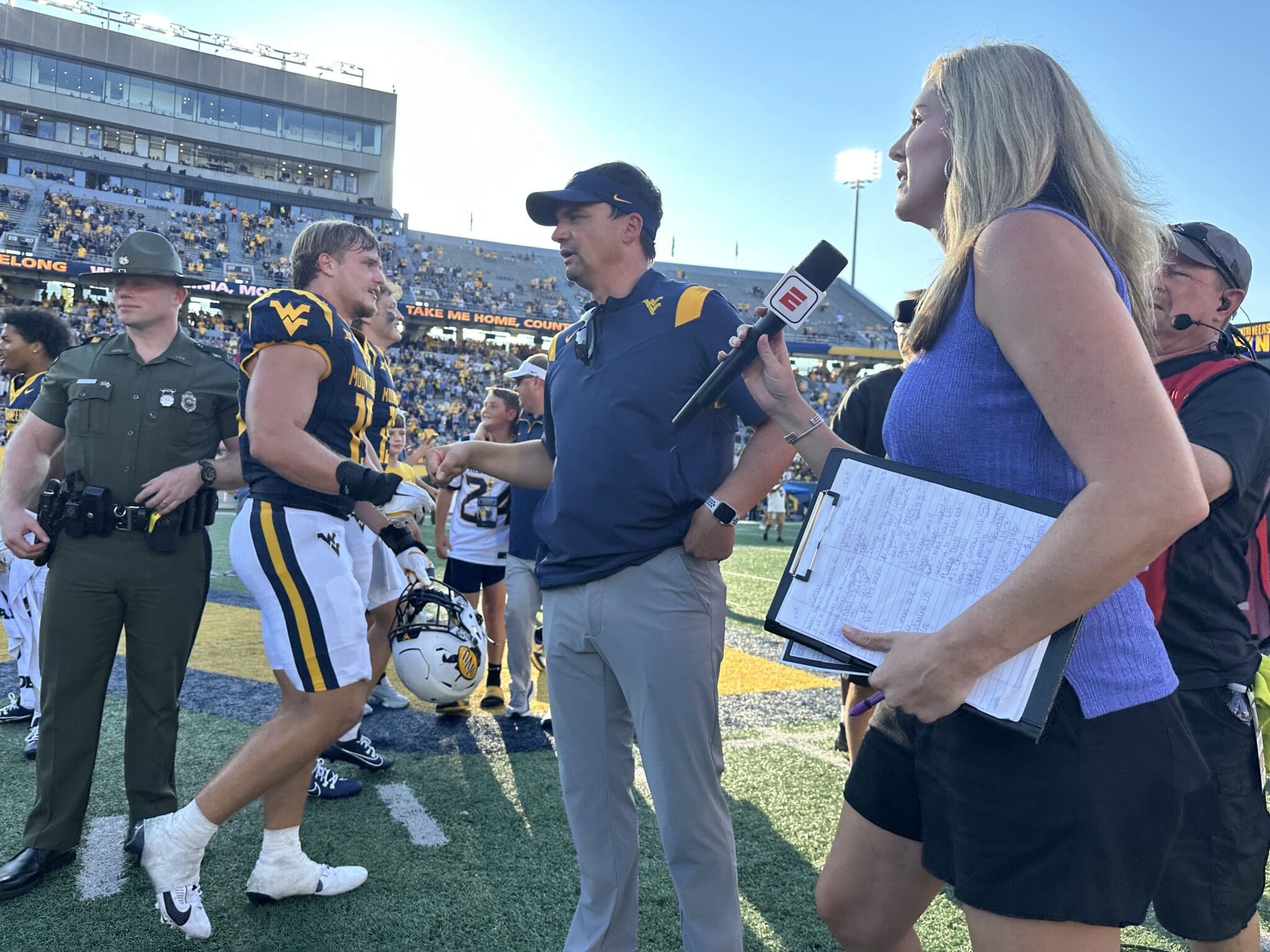 WVU Football HC Neal Brown with ESPN reporter
