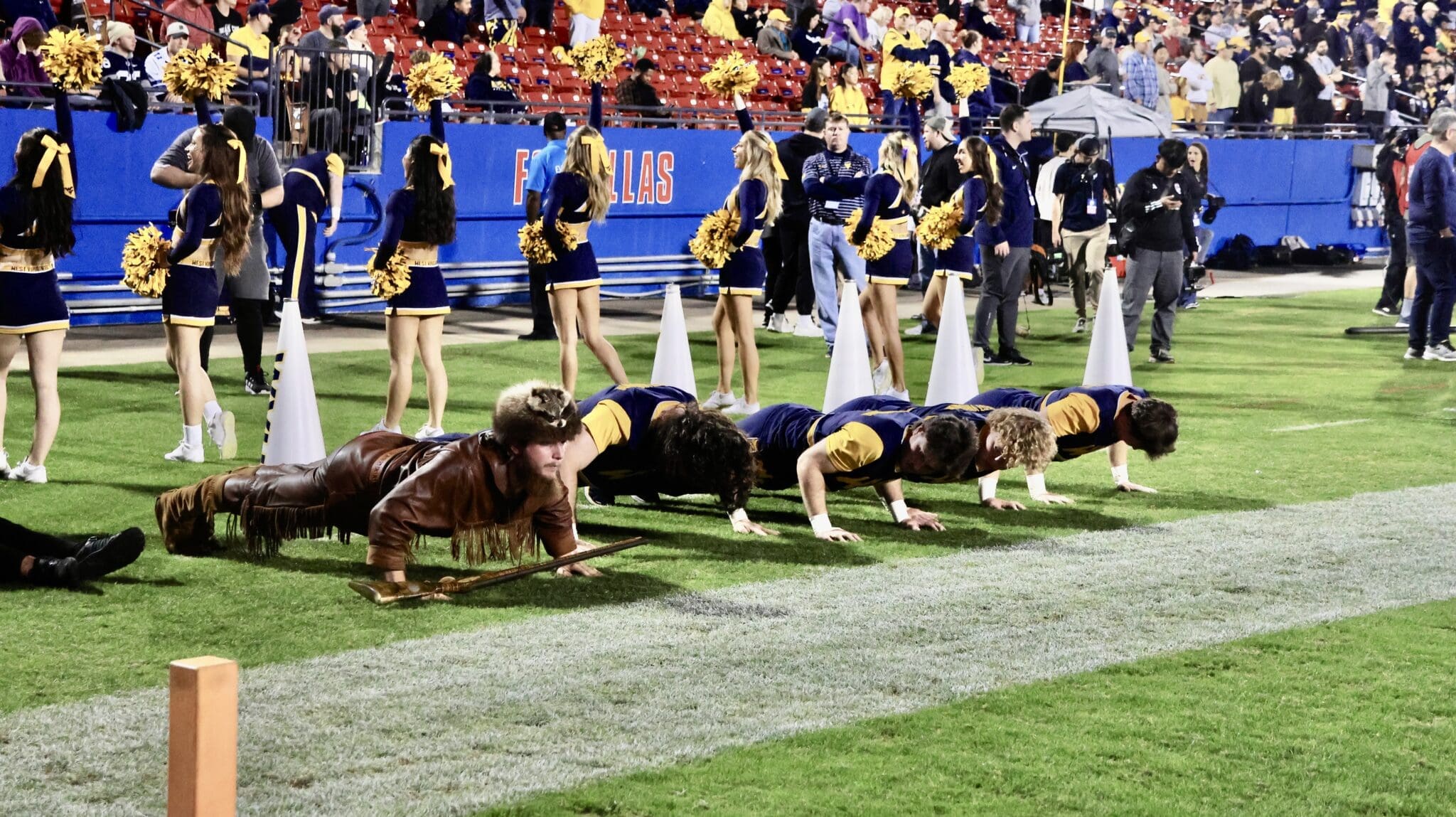WVU cheerleaders and mascot at Frisco Bowl stock