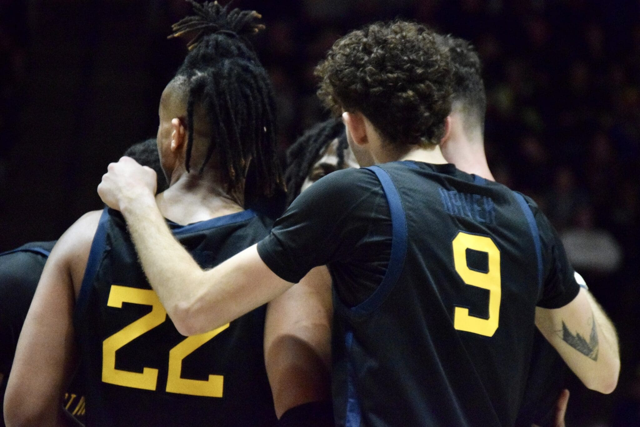 WVU Basketball Huddle/Black Uniform