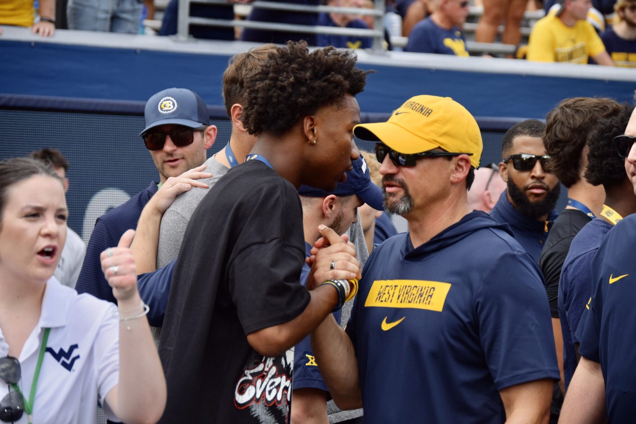 WVU Football HC Neal Brown with recruit