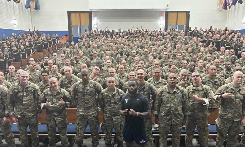 WVU Football safety Anthony Wilson with Army soldiers