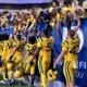 WVU Fans and players like Sean Martin after a win