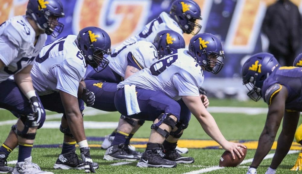 WVU Football line of scrimmage stock