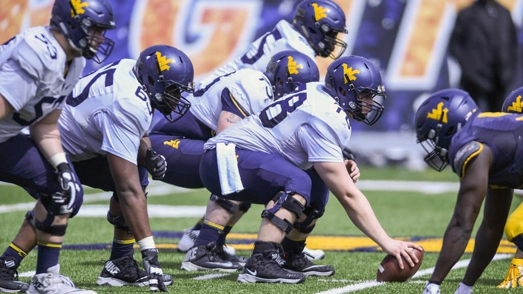 WVU Football line of scrimmage stock