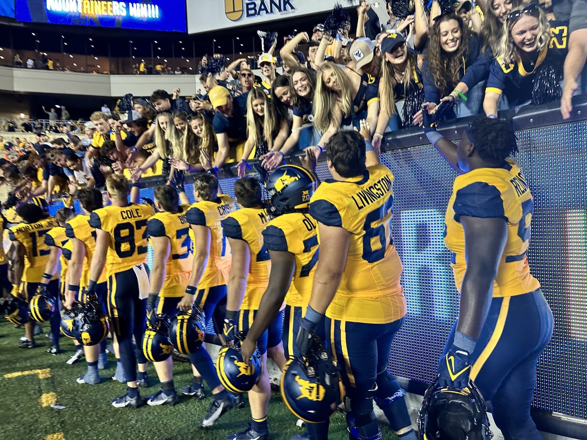 West Virginia Football players celebrating