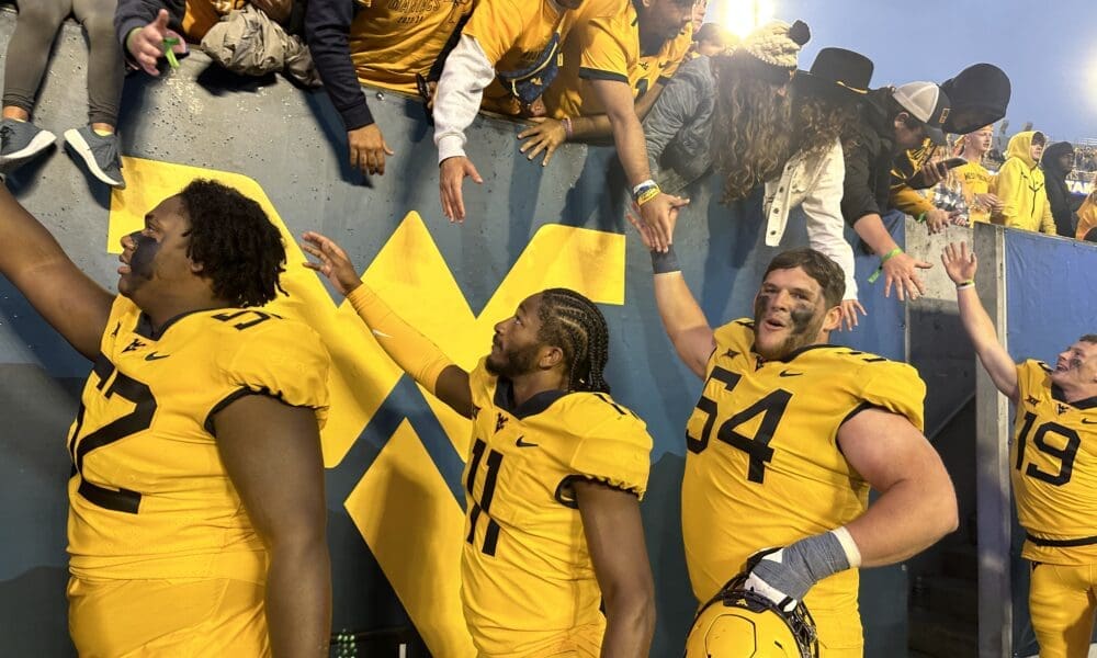 WVU Football Zach Frazier and Beanie Bishop with fans