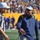 WVU Football HC Neal Brown and ref
