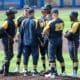 WVU baseball team on mound with Carson Reed