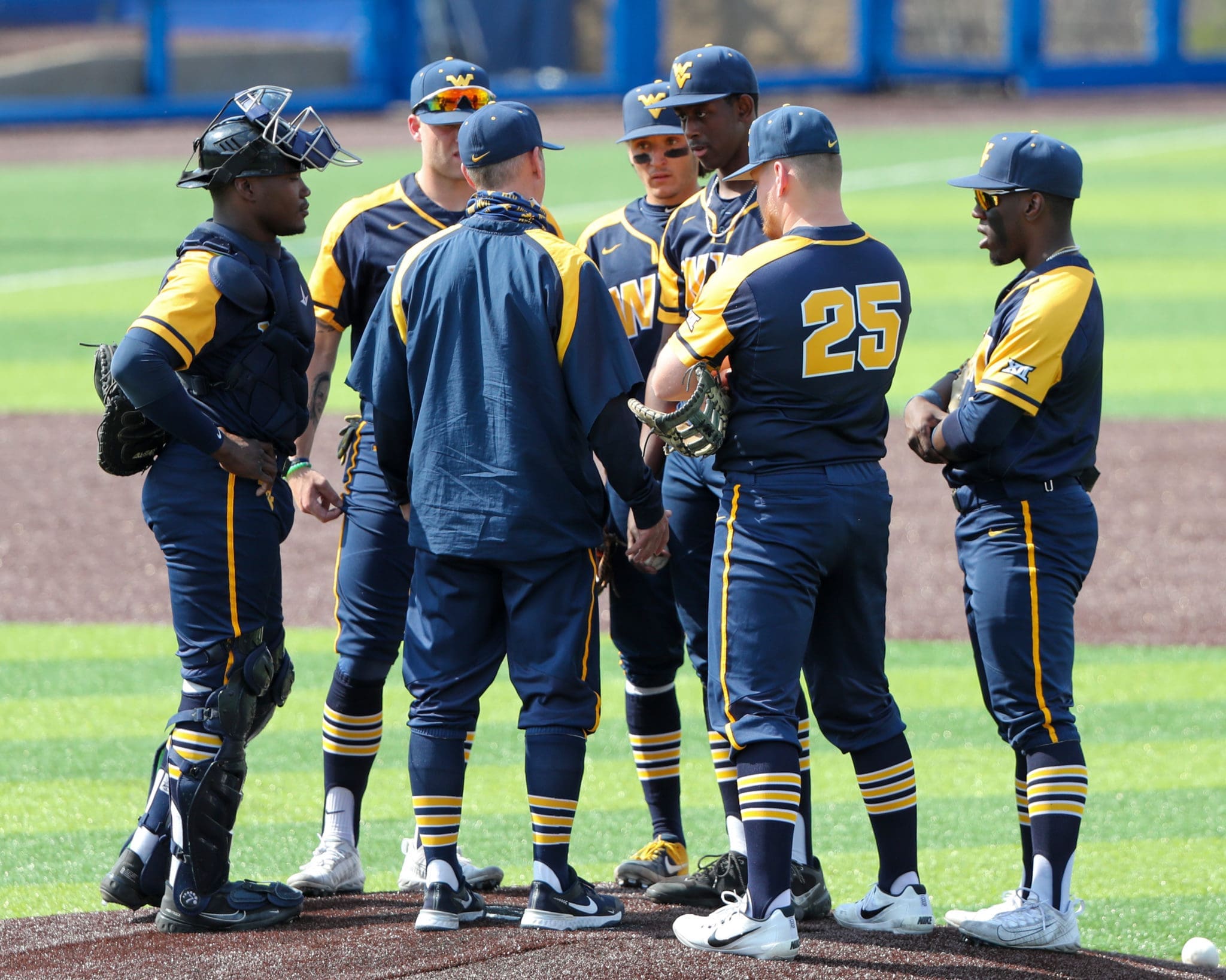 WVU baseball team on mound with Carson Reed