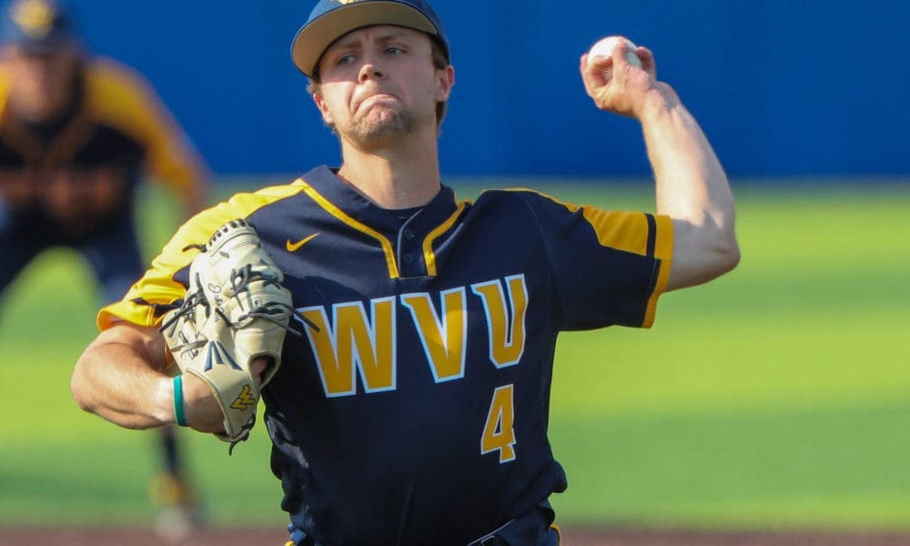 WVU pitcher Jake Carr winds up for a throw.