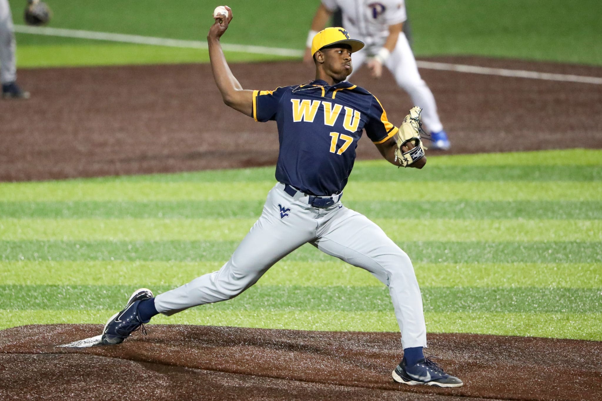 WVU Baseball reliever Carlson Reed winds up to throw.