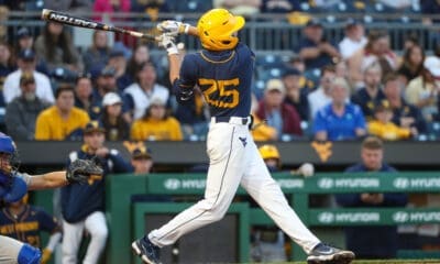 WVU Baseball left fielder Landon Wallace admires his swing.