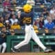 WVU Baseball left fielder Landon Wallace admires his swing.