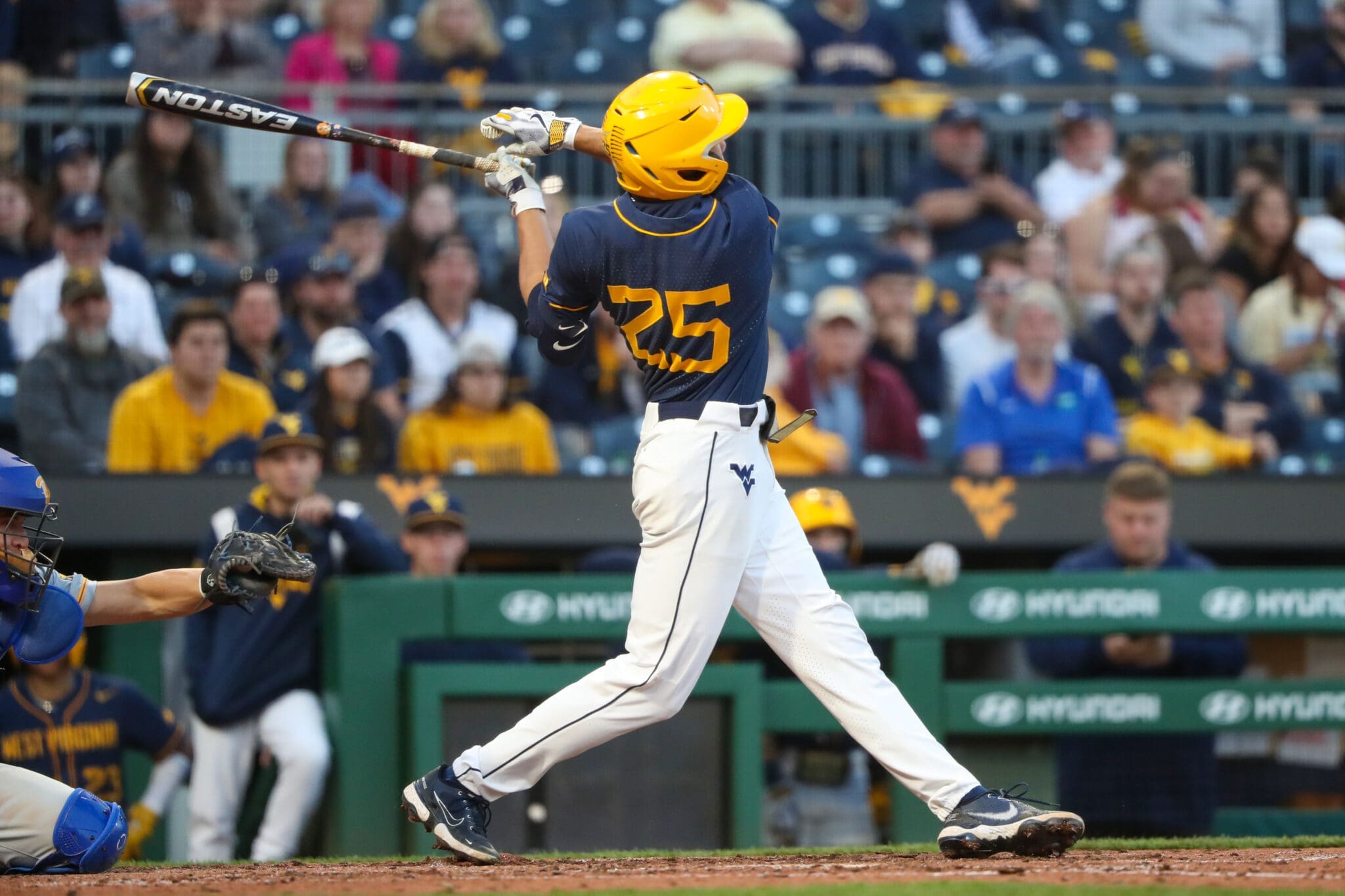 WVU Baseball left fielder Landon Wallace admires his swing.