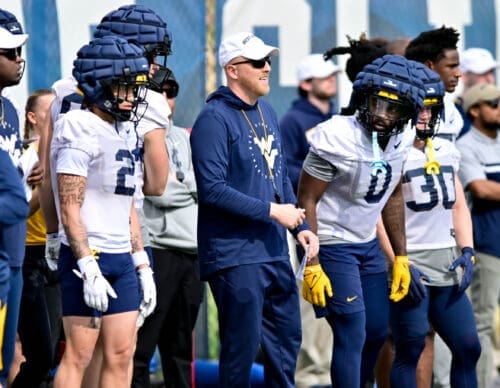 WVU Football TE Coach Blaine Stewart with players Rodney Gallagher and Jaylen Anderson