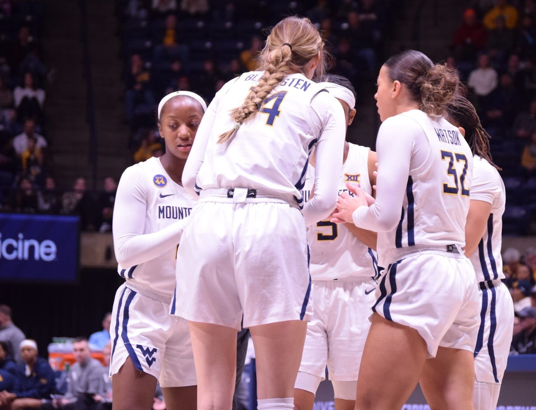WVU women’s basketball huddle