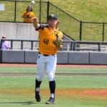 WVU Baseball pitcher Aidan Major throws to first base to make an out for the Mountaineers.