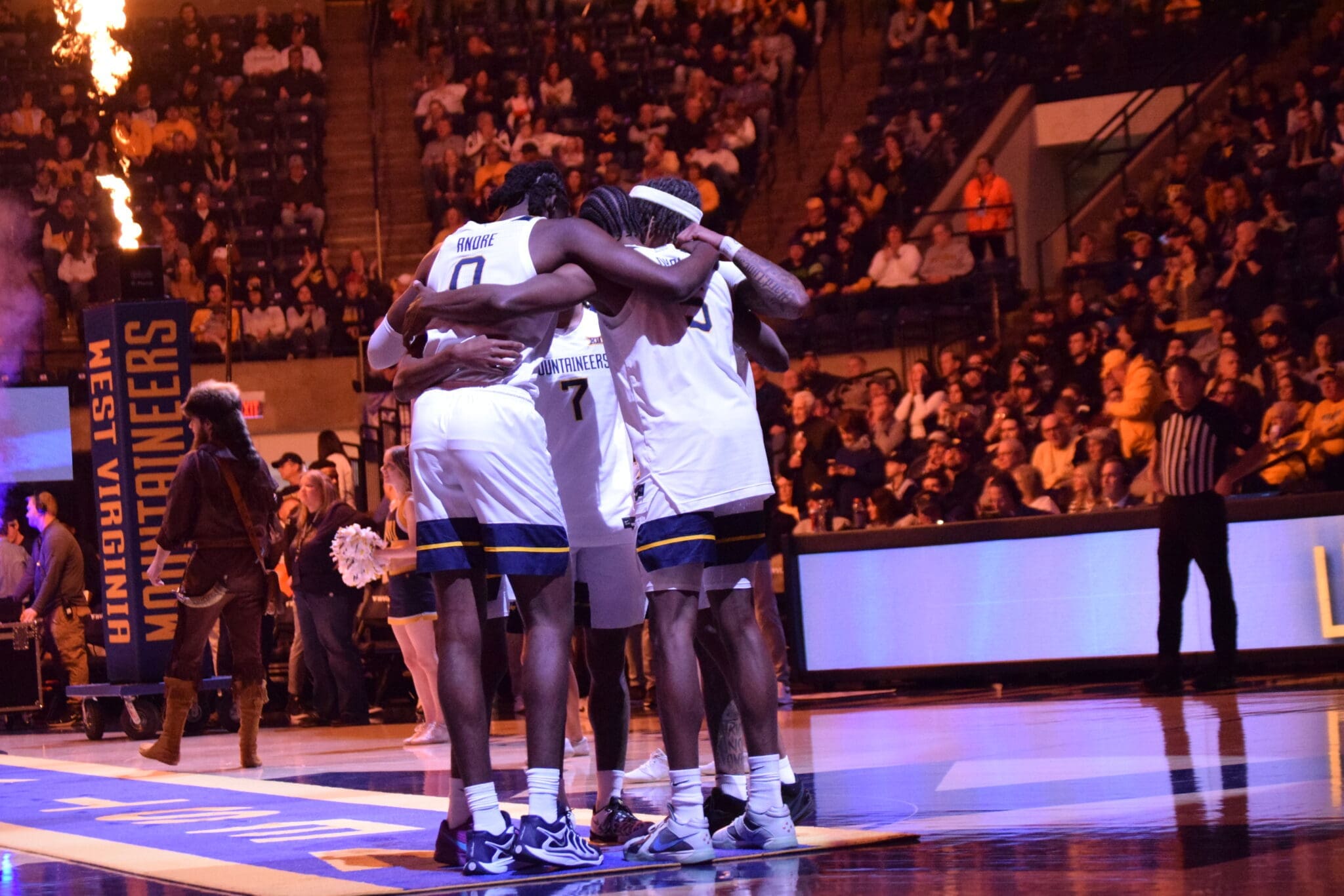 WVU Basketball huddle stock