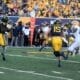 WVU Football QB Scotty Fox Jr. tosses the ball to RB Tye Edwards