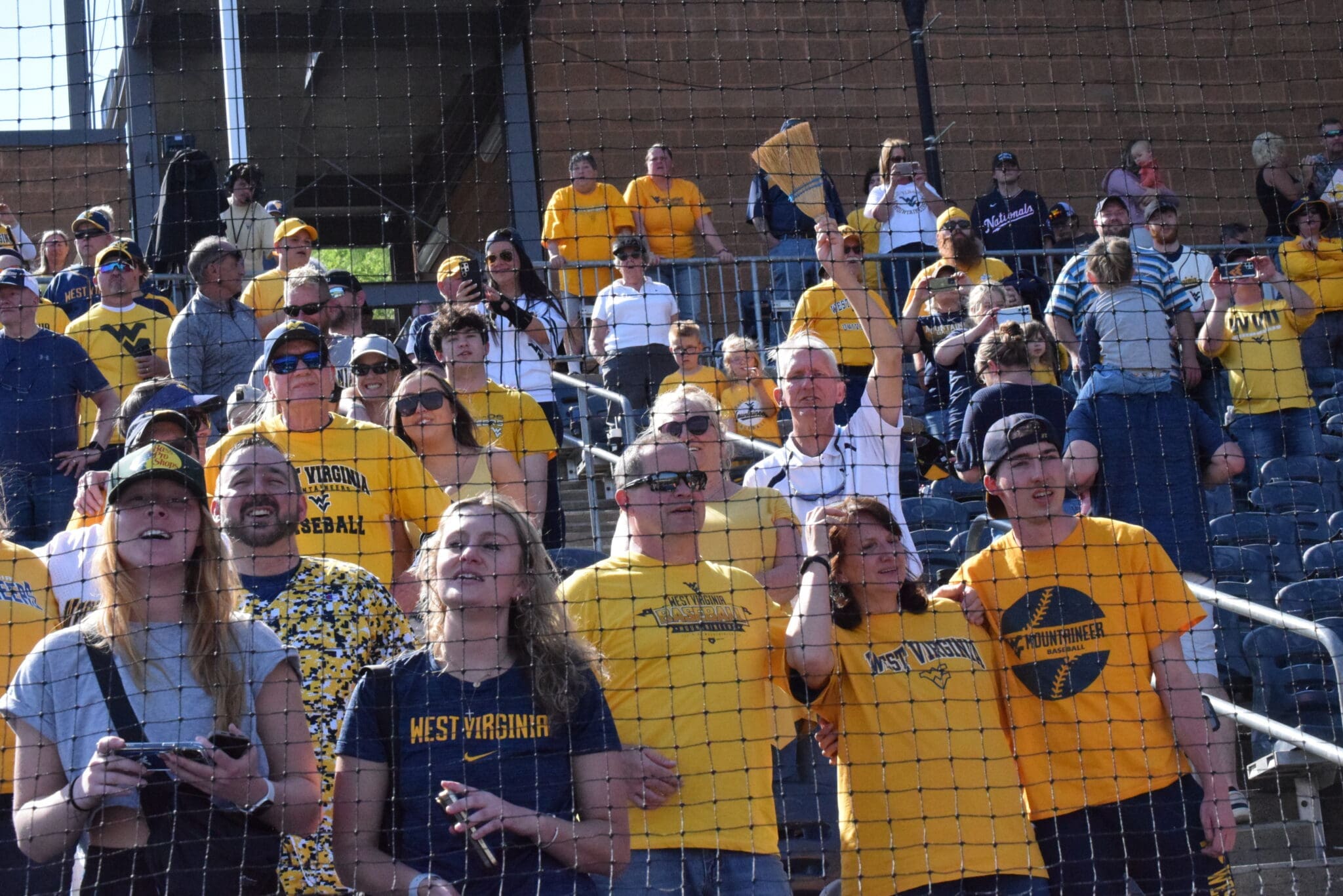 WVU Baseball fans with broom