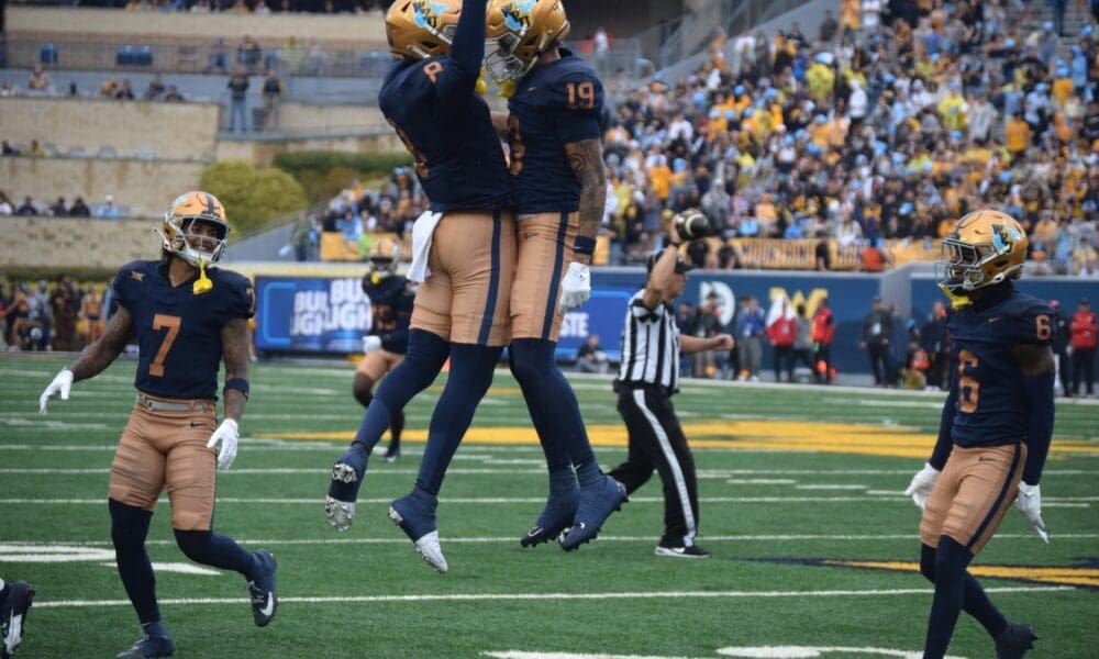 WVU Football CB Nick Taylor (19) celebrates interception versus Utah