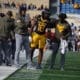WVU Football HC Rich Rodriguez, Curtis Jones and Larry Porter