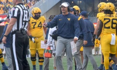 WVU Football HC Neal Brown and ref and Wyatt Milum