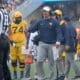 WVU Football HC Neal Brown and ref and Wyatt Milum