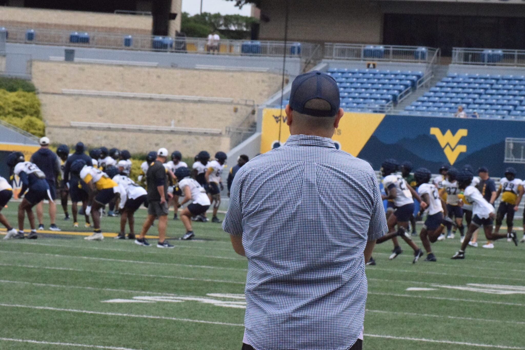 Mike Asti watching WVU football practice