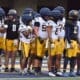 WVU Football Jaylen Henderson and Nicco Marchiol with team at spring showcase