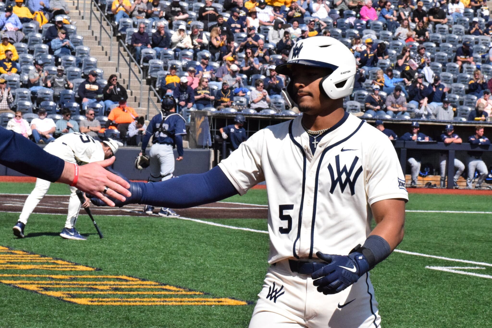 WVU Baseball Armani Guzman hand slap