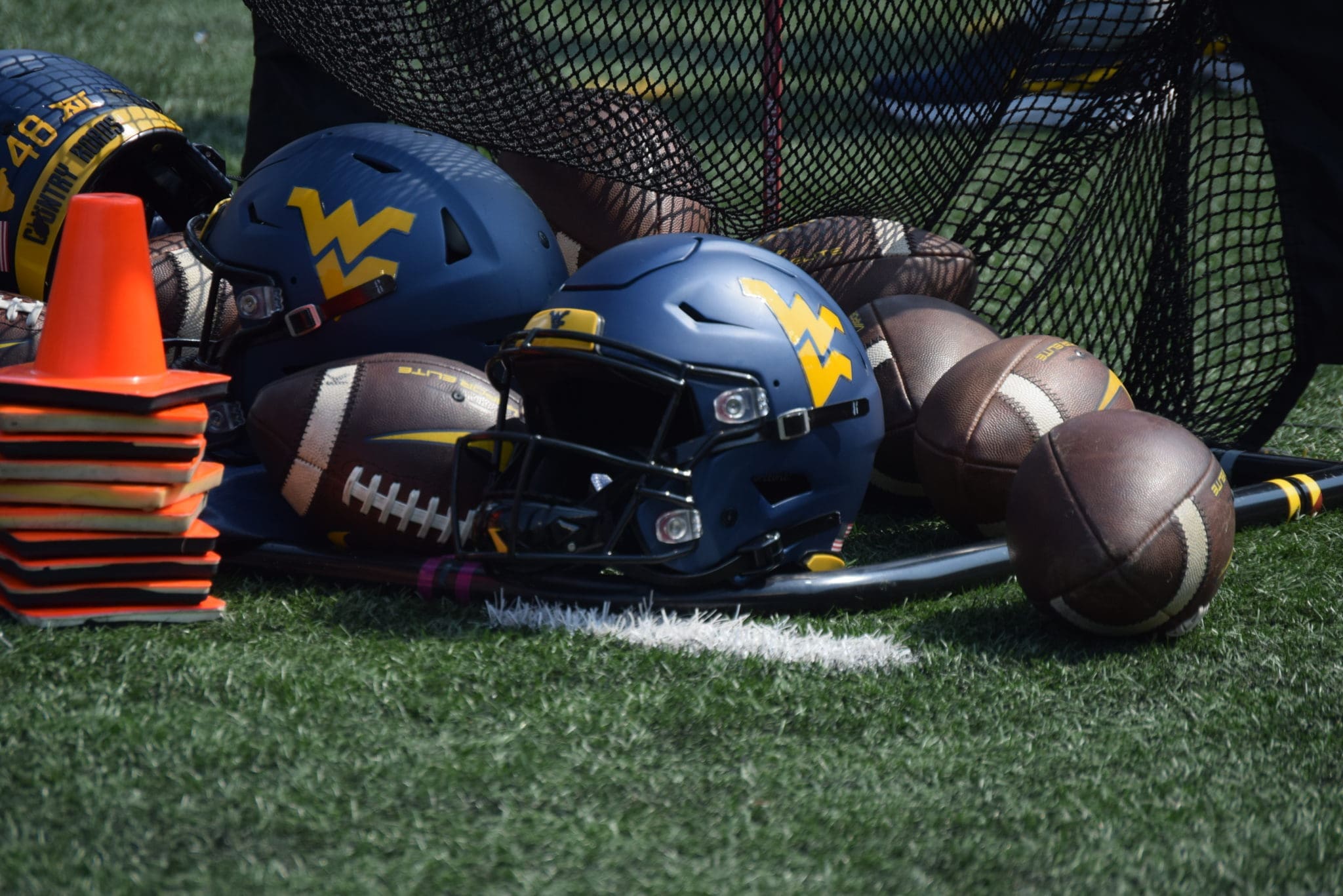 WVU footballs and helmets stock