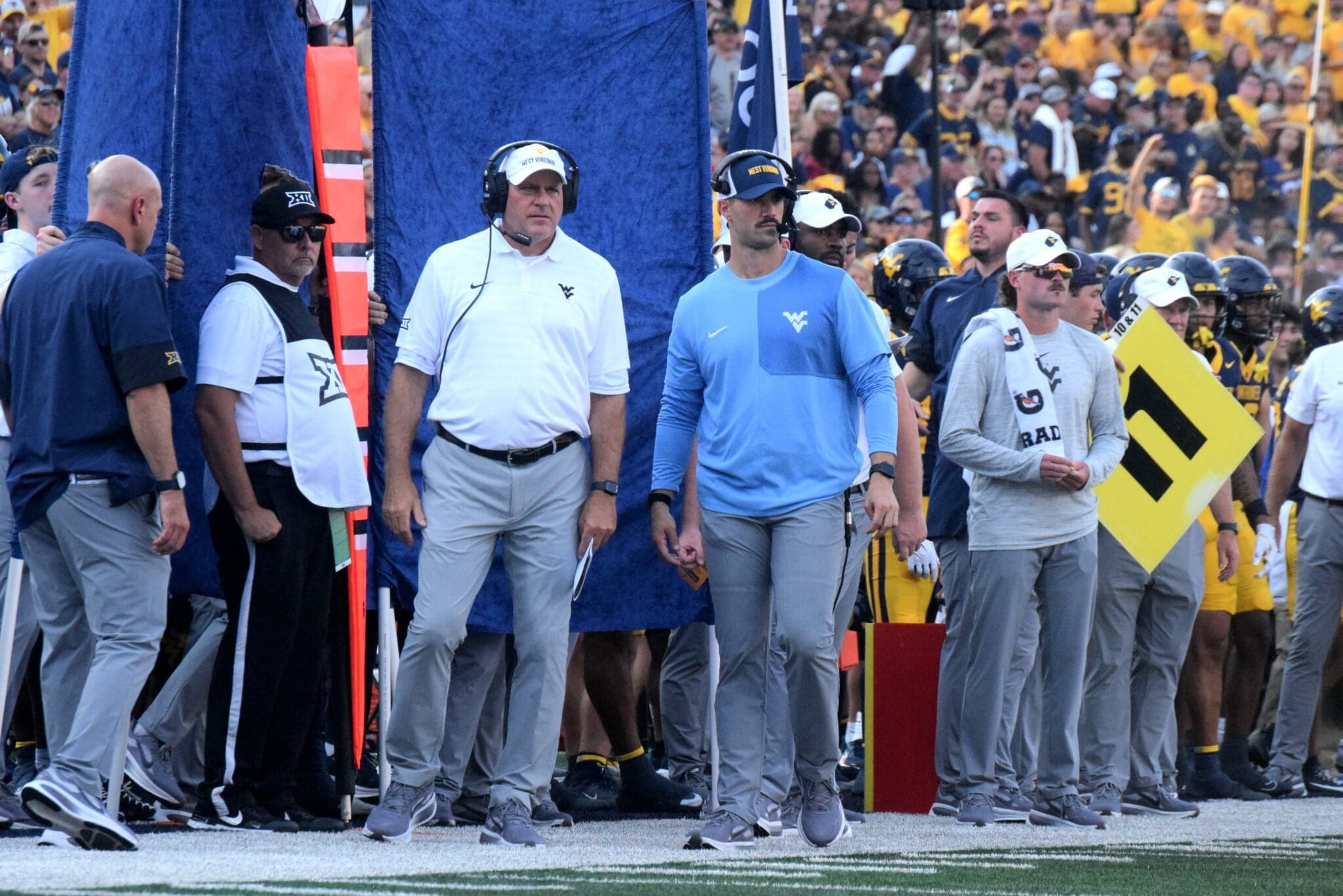 WVU Football Rich Rodriguez and Zac Alley on sideline