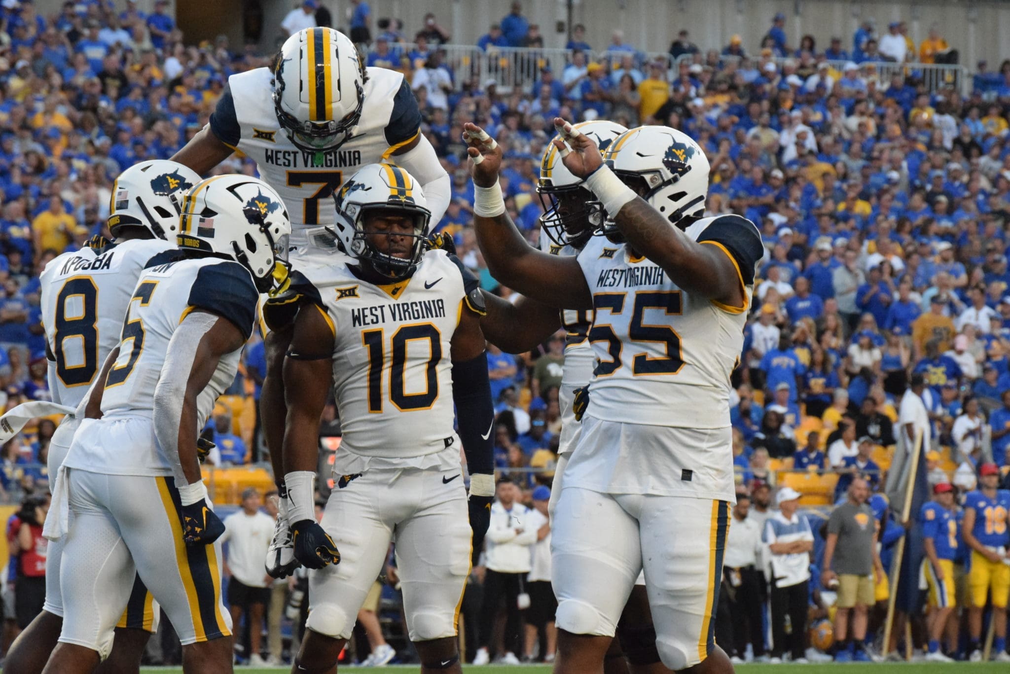 WVU defense celebrates at Pitt