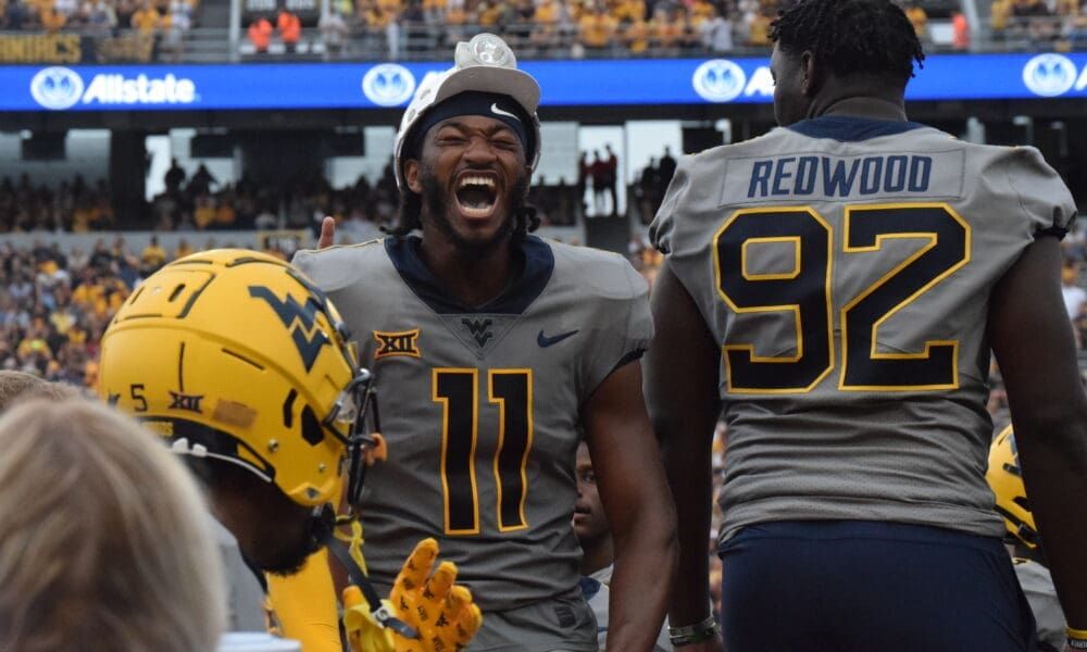 WVU Football Beanie Bishop celebrating an interception