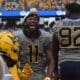 WVU Football Beanie Bishop celebrating an interception